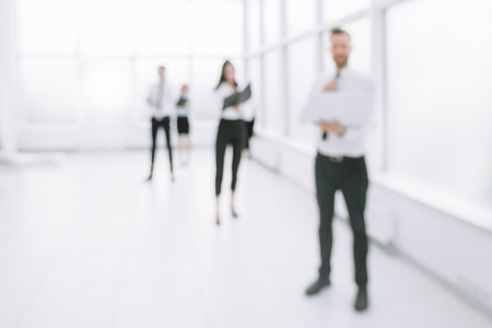 blurred image of employees standing in the office lobbyの写真素材