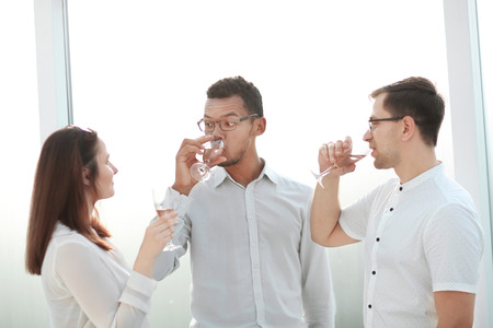 close up.business team clinking glasses of wineの写真素材