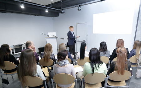 Manager makes a presentation to his business teamの写真素材