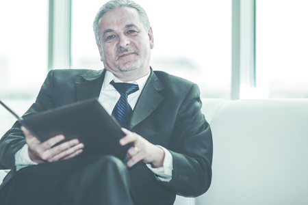 experienced lawyer reviews the documents with the terms of a new contractの写真素材