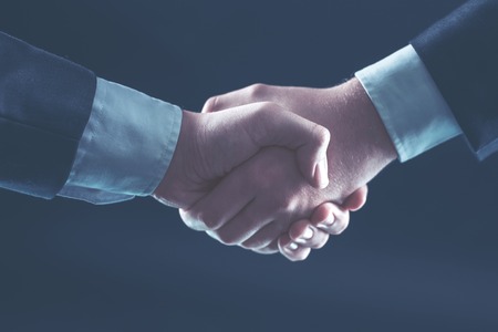 concept of partnership in business: a handshake of business partners.の写真素材