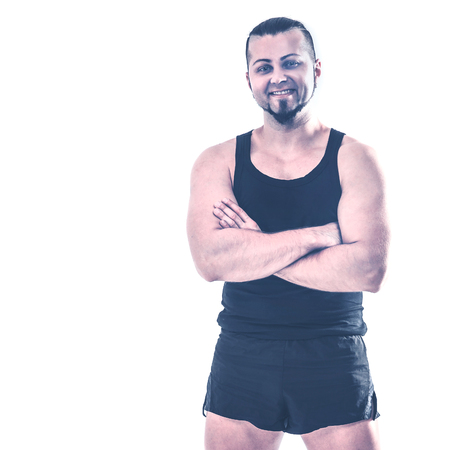 portrait of charismatic trainer on bodybuilding on a light backgの写真素材