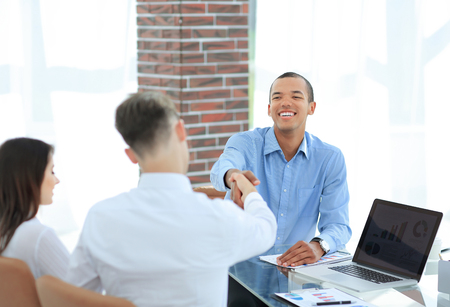 young entrepreneurs shaking hands with each otherの写真素材