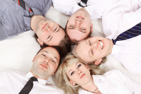 .closeup close-knit business team. isolated on white.の写真素材