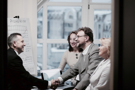 business handshake confident partner in the officeの写真素材