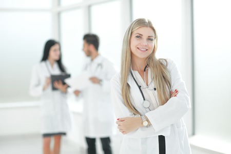 young pediatrician doctor standing in the hallway of the medical centerの写真素材