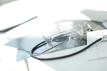 image stethoscope and documents on the table at the surgeonの写真素材