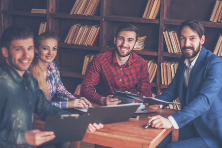 business team discussing a financial report on the companys proの写真素材