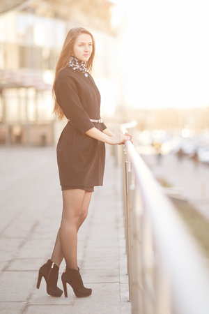 young businesswoman standing near a modern office buildingの写真素材