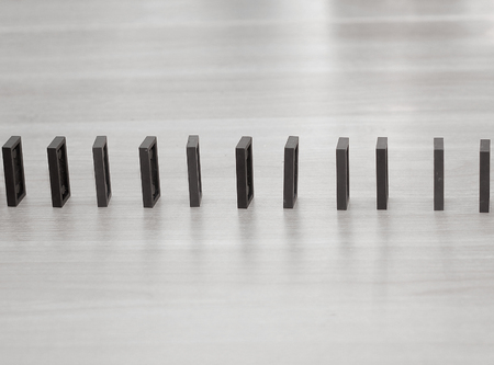 close up. Domino chips are built in a row on the desktop businessmanの写真素材