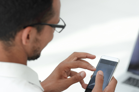 Business men using a modern smartphoneの写真素材