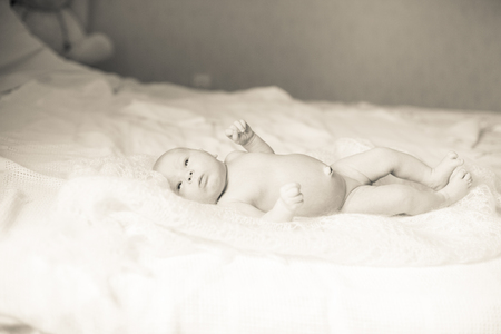 pretty newborn baby lying on a blanket.の写真素材