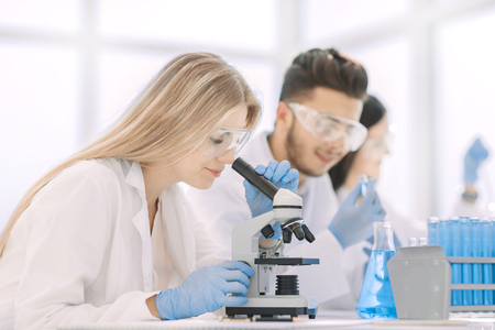 close up.woman scientist conducting experiments with liquidの写真素材