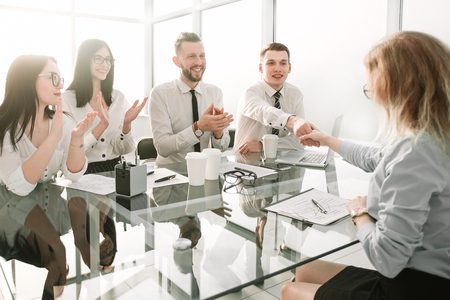 businesswoman congratulates the employee with the signing of a new employment contractの写真素材