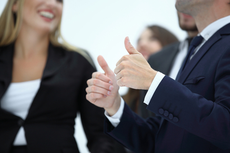 close up.businessman showing thumbs up.isolated on whiteの写真素材