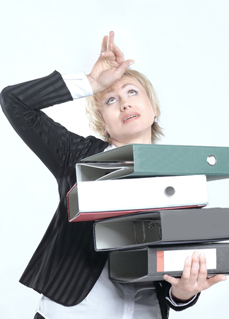astonished business woman with stack of documentsの写真素材