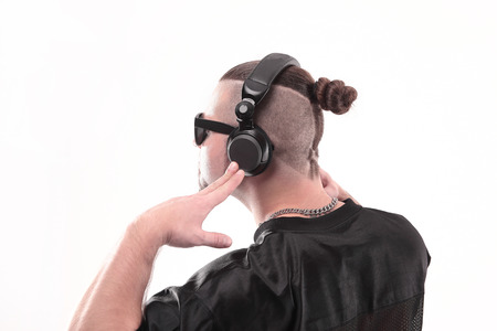 close up.side view. the rapper guy in the headphones is looking at a copy of the spaceの写真素材