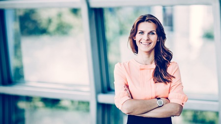 portrait of successful business woman on the background of the spacious officeの写真素材