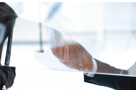bottom view.the handshake business partners for their Desk