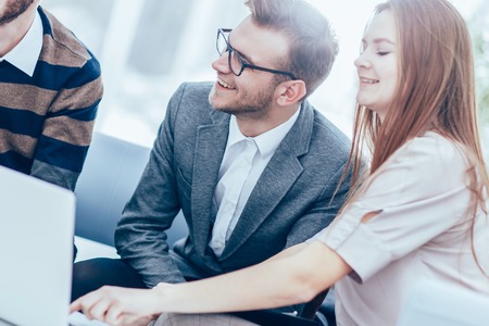 successful business team with laptop at workplace discuss workiの写真素材