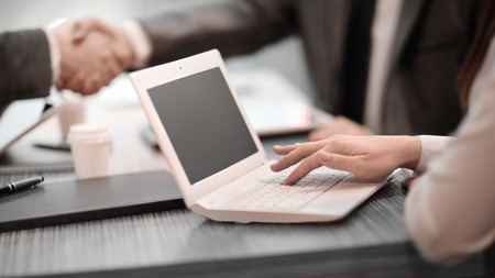 close up.business woman typing on laptop during business meeting.の写真素材