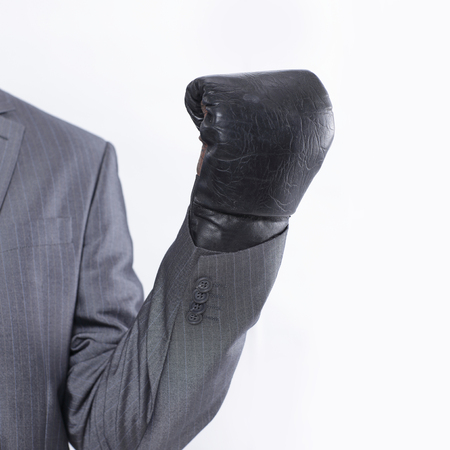 young businessman in Boxing gloves.isolated on white backgroundの写真素材
