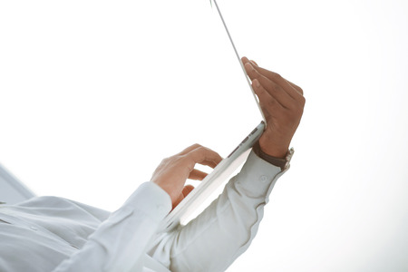 close up. image of a businessman holding an open laptop . photo with copy spaceの写真素材