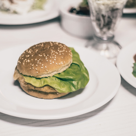 hamburger and other fast food on the table in the cafe.の写真素材