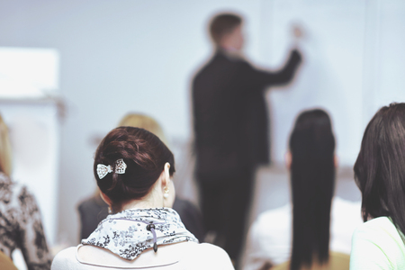 rear view. the blurred image of the conference hallの写真素材