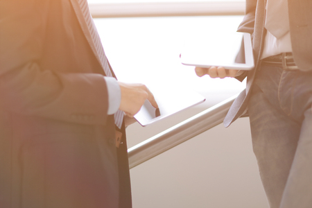 Two businessmen with tablet computersの写真素材