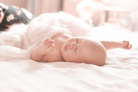 Cute newborn baby is sleeping in the nursery.の写真素材