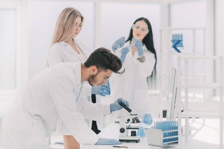 group of young scientist experimenting in the laboratoryの写真素材