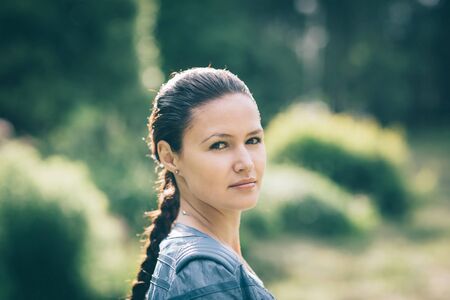 portrait of a beautiful young woman on the background of nature.の写真素材