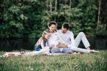 Happy family on a picnic on a summer day.の写真素材