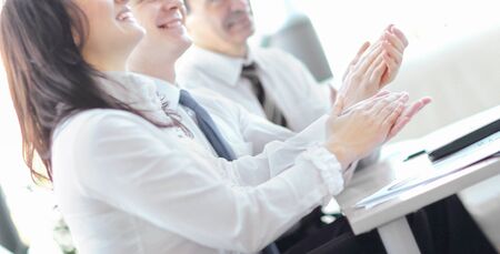 Business people clapping hands.