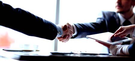 handshake of business partners at the meeting in the officeの写真素材