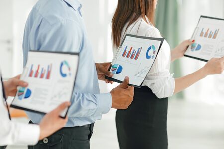 closeup.business team keeps files of financial graphsの写真素材