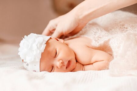 portrait of newborn daughter in beautiful bonnet.の写真素材