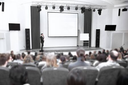 businessman man standing on stage during a press conferenceの写真素材