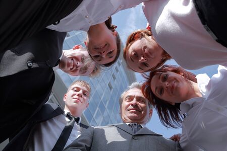 bottom view.successful business team standing in the circleの写真素材