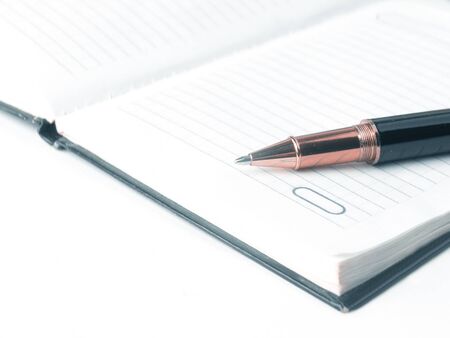 close up.diary and ball point pen on the background of school supplies