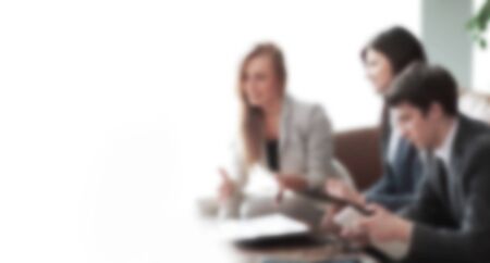 successful business team discussing new ideas in the blur .the concept of teamworkの写真素材