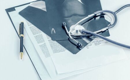Medical documents of fluorography with pen and stethoscope the tの写真素材