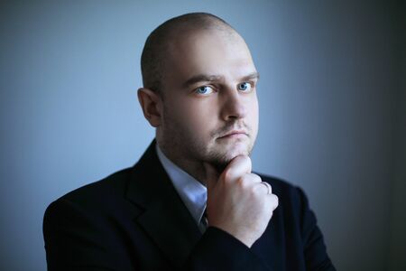 close up. thoughtful businessman looking at copy spaceの写真素材