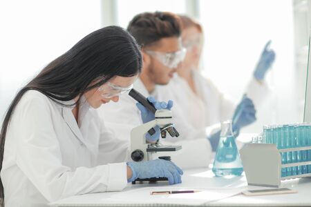 close up.scientists and laboratory workers sitting at the laboratory tableの写真素材