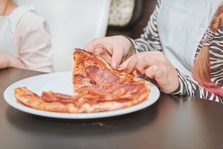 close up. small participants of the master class eat pizzaの写真素材