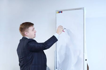 close up.businessman writes a marker on the Boardの写真素材