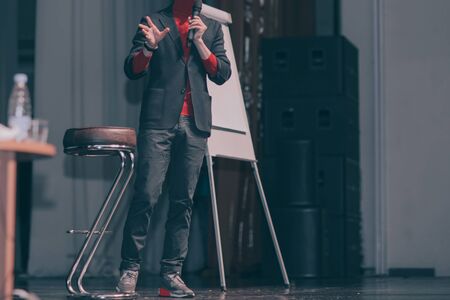 cropped image .lecturer, making a report in the conference room.