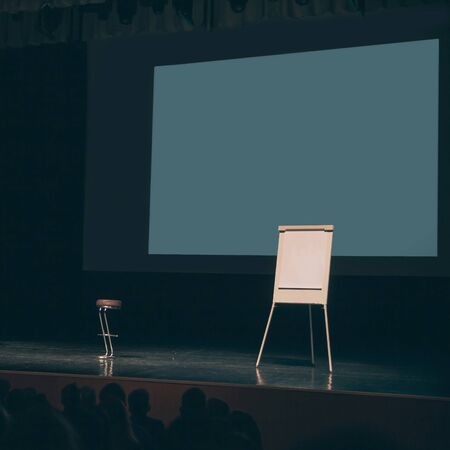 large screen and flipchart on the podium in the conference roomの写真素材