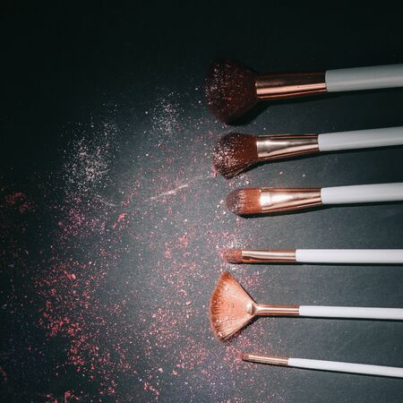 nine professional makeup brushes on a black backgroundの写真素材
